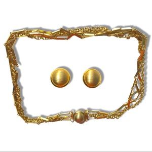 Matching golden necklace and earrings set